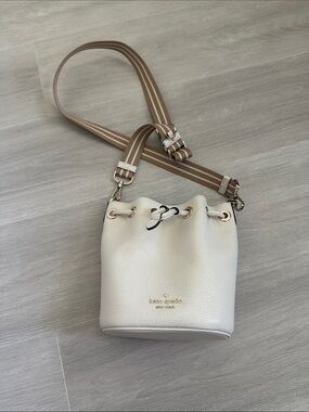 kate spade Cream Pebbled Leather Drawstring Bucket Bag with Striped Strap